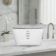 Customizable white pouch with "your image or design" placeholder pattern sitting on a bathroom counter.