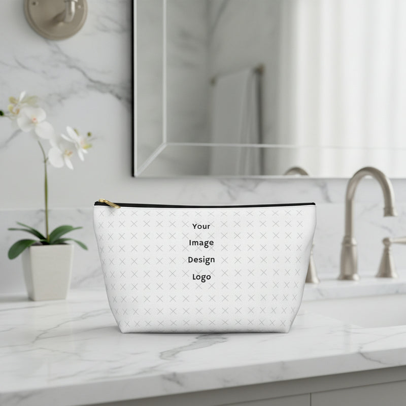 Customizable white pouch with "your image or design" placeholder pattern sitting on a bathroom counter.