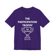A purple t-shirt with 'The Participation Trophy 1st Place' white text and white graphic.