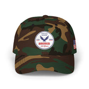 Camouflage classic ball cap with a circular emblem featuring an eagle and text , along with the American flag on the side on a white background. 