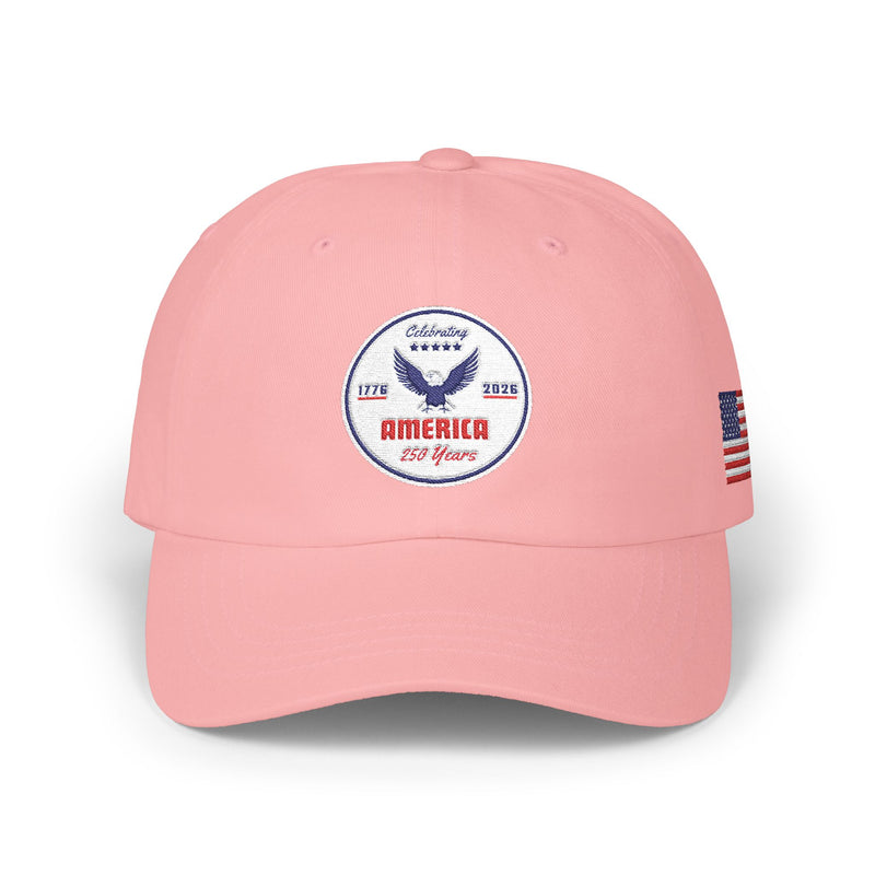 All pink classic ball cap with a circular emblem featuring an eagle and text , along with the American flag on the side on a white background.