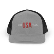 Black and grey trucker cap with 'USA 250 YEARS' text on a white background.
