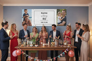Custom matte photo banner with two family photos and center panel for name, age, and date hanging above a party table, 96x36 inches.