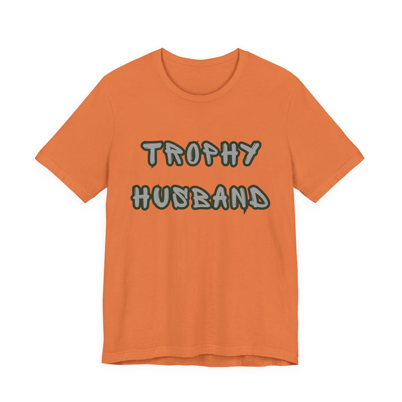 Orange t-shirt with 'Trophy Husband' text on a white background