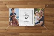 Custom matte photo banner with two family photos and center panel for name, age, and date, 72x36 and 48x24 inches on wood wall.