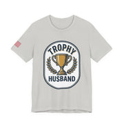 Gray t-shirt with 'Trophy Husband' graphic design on a white background