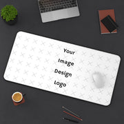 Customizable desk mat image with a "your image here" placeholder at an angle on desk with computer. 