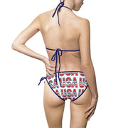 oman wearing a red, white, and blue 'USA' patterned bikini on a white background with navy blue biking strings pictured from the back.