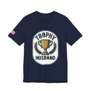 Navy blue t-shirt with 'Trophy Husband' graphic design on a white background