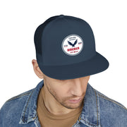 Man wearing an all navy blue flat bill trucker cap with a logo 'celebrating America 250 years' on a white background.