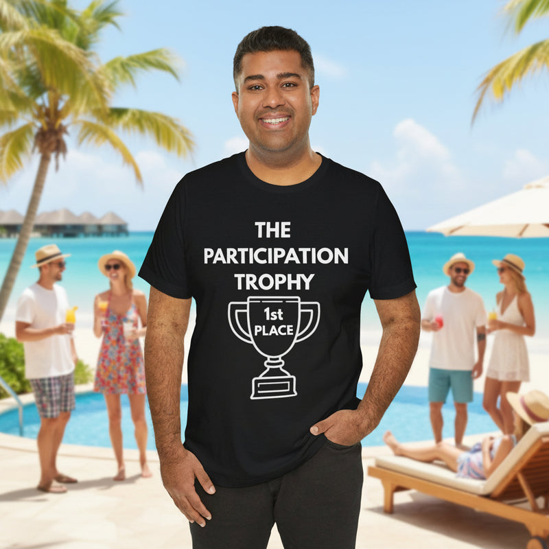 Man wearing a black t-shirt with 'The Participation Trophy 1st Place' white text and white graphic in front of pool. 