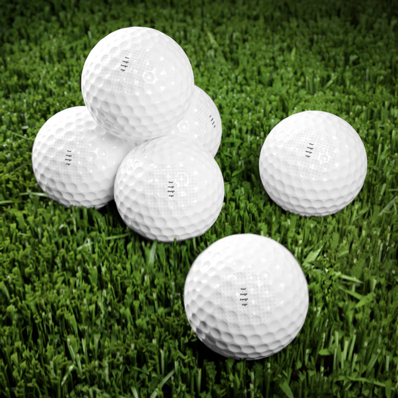 Customizable white multiple golf balls with a "your design or words" placeholder on grass.