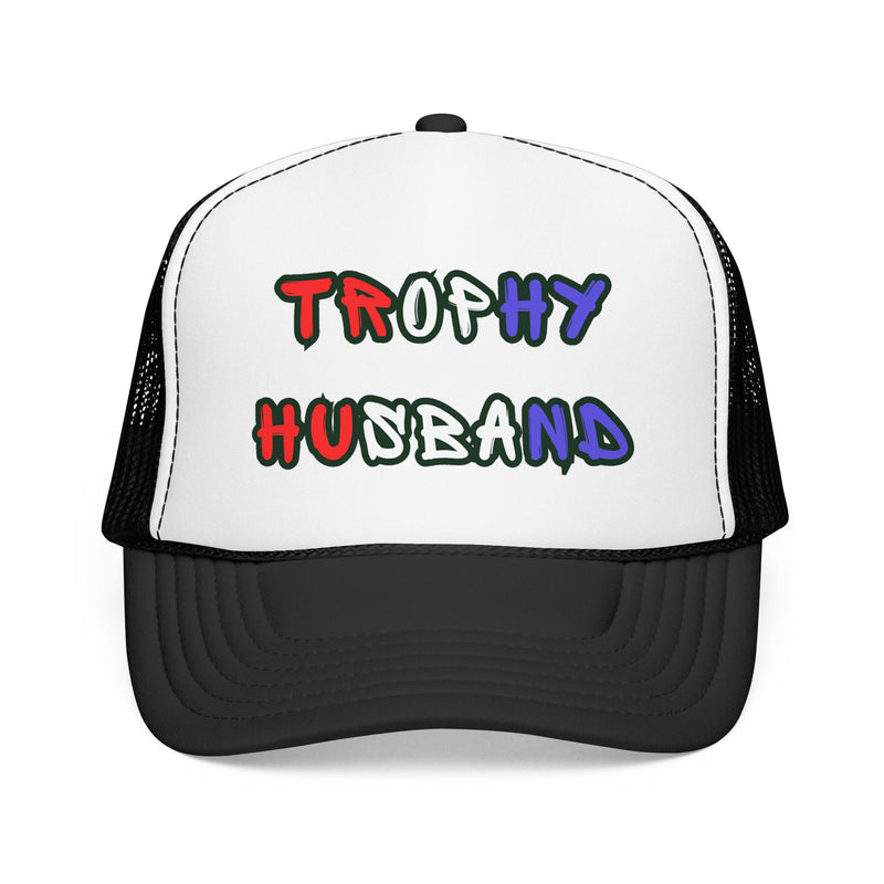 Black and White Trucker hat with 'Trophy Husband' in red white and blue text, standing against a white background