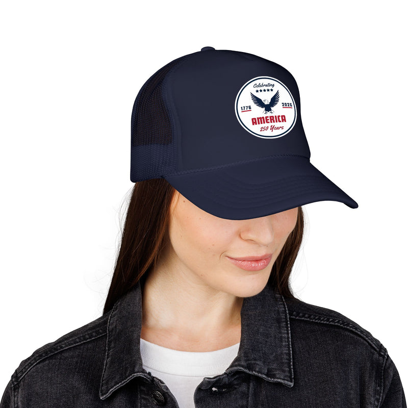 All navy blue trucker hat with 'Celebrating America for 250 Years' design displayed on female on a white background.
