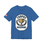 Blue t-shirt with 'Trophy Husband' graphic on a white background