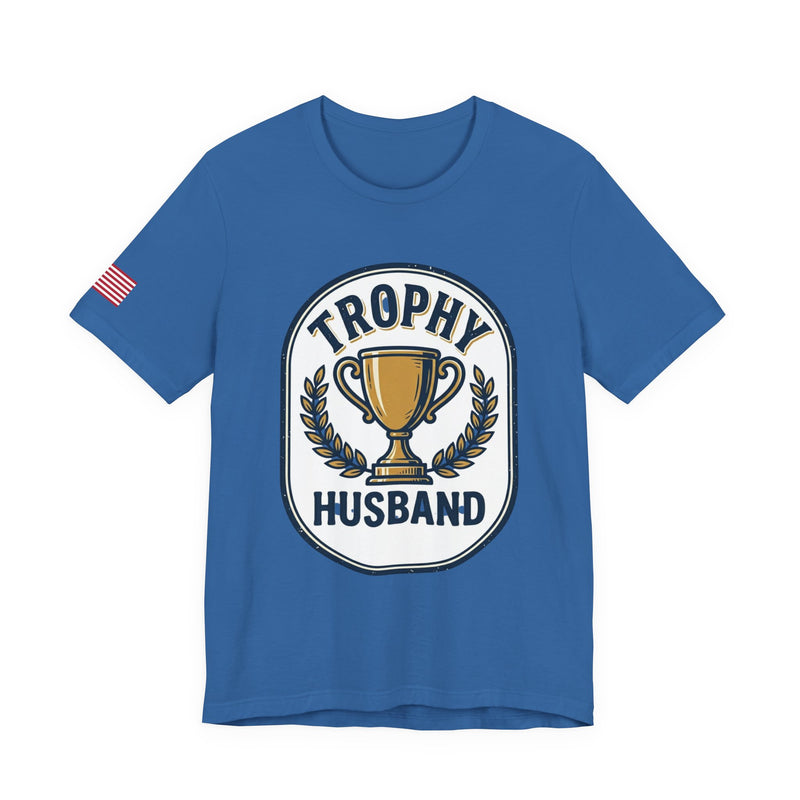 Blue t-shirt with 'Trophy Husband' graphic on a white background