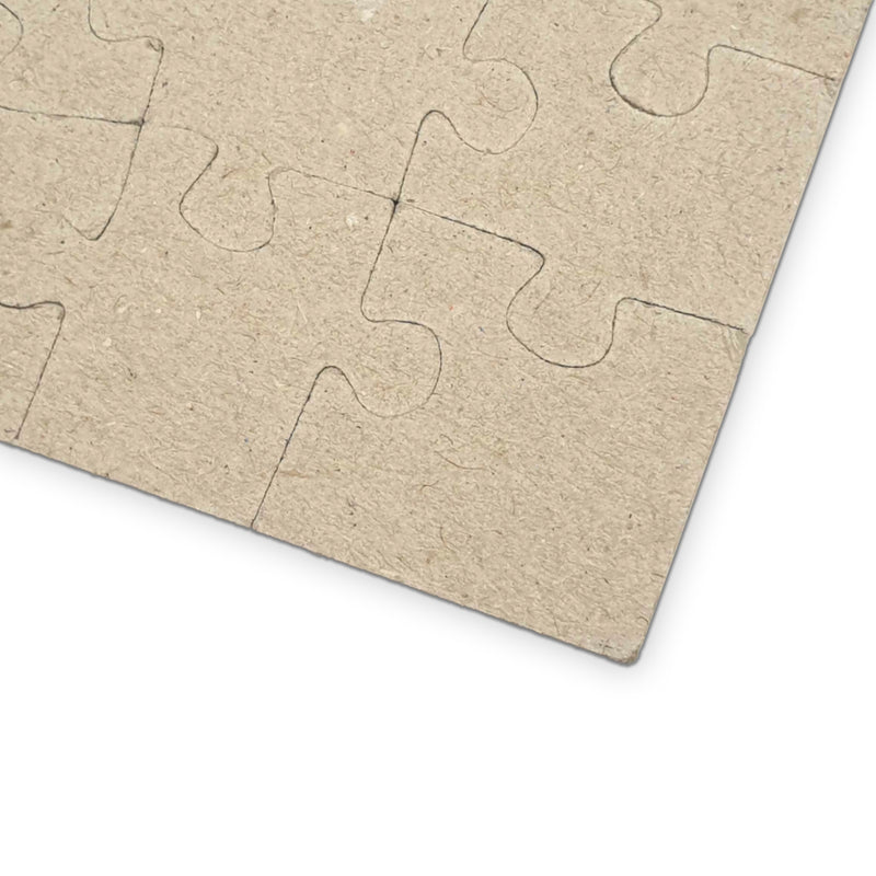 The back of a customizable cardboard puzzle showing the back pieces on a white background.