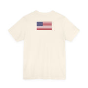 Back of a beige t-shirt with American flag on a white background