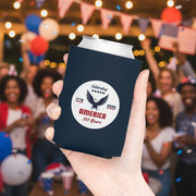 A Navy blue can cooler with a white circular design featuring an eagle and America 250 years text on a white background held in a hand with beverage in it.