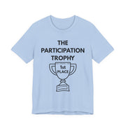 Light blue t-shirt with 'The Participation Trophy 1st Place' text and graphic on a white background