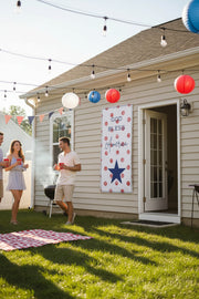 Patriotic “God Bless America” vinyl banner with red polka dot background hanging in backyard, 72x36 and 48x24 inches.