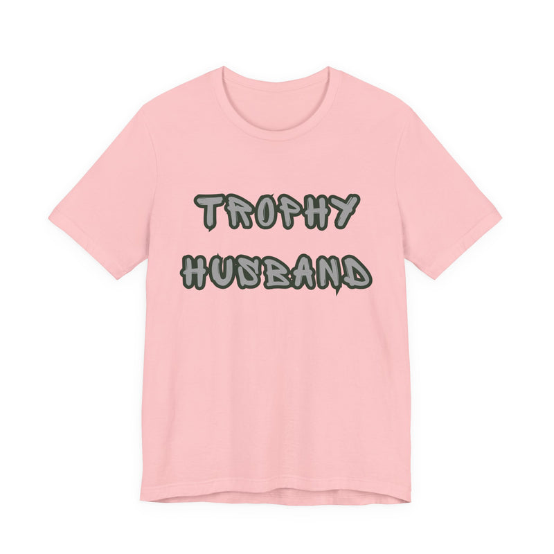 Pink t-shirt with 'Trophy Husband' text on a white background