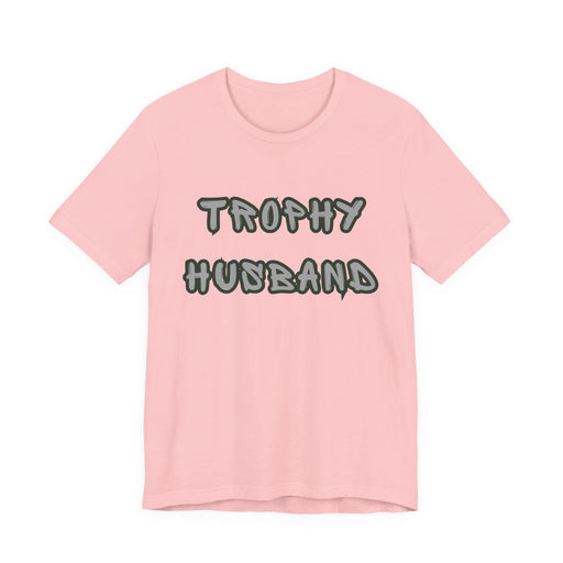 Pink t-shirt with 'Trophy Husband' text on a white background