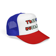 side ways view of a red white and blue trucker hat with 'Trophy Husband' in red white and blue text, against a white background