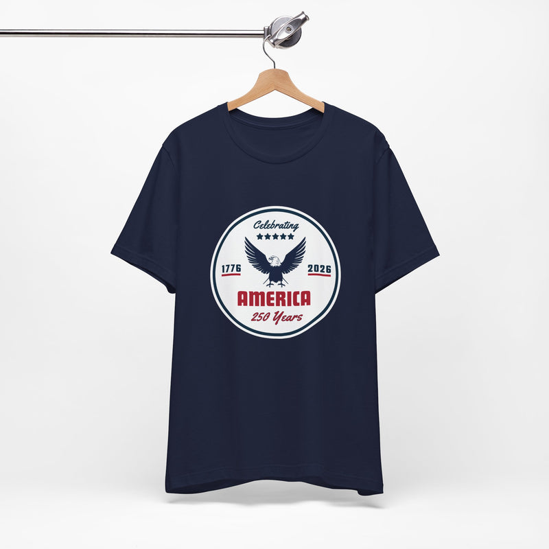 Navy blue t-shirt with 'Celebrating America 250 years' graphic and text on a hanger against a white background.