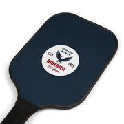 Navy blue pickleball paddle laying at an angle with a white logo that says 'Celebrating America 250 years' on a white background. 