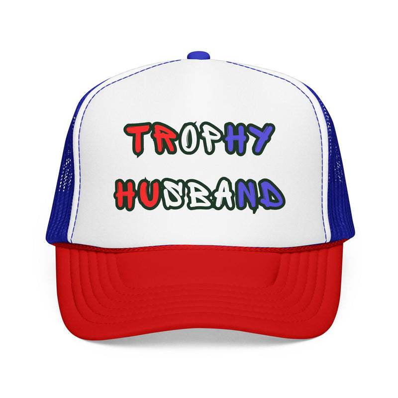 Red white and blue Trucker hat with 'Trophy Husband' in red white and blue text, against a white background
