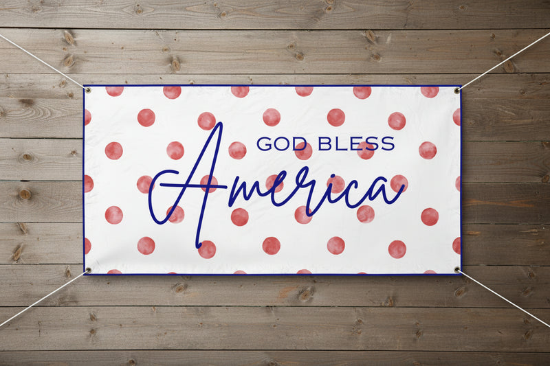 Patriotic “God Bless America” vinyl banner with red polka dot background, 72x36 and 48x24 inches on wood fence.  