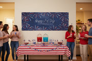 Custom patriotic “Happy 4th of July” matte banner with blue stripes and red and blue stars hanging above a party table, 96x36 inches.