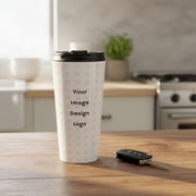 Customizable stainless steel travel mug with "your image or design" placeholder on a kitchen table next to a set of keys. 
