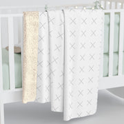Customizable sherpa fleece blanket with "your image or design" placeholder laying on a crib. 