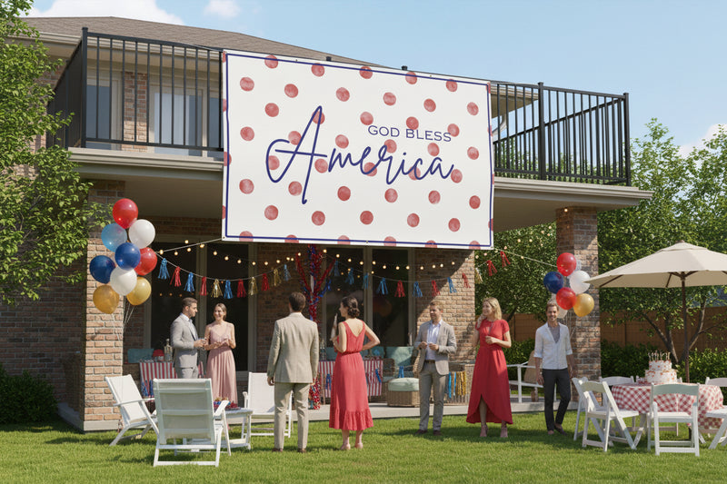 Patriotic “God Bless America” matte banner with red polka dot background hanging above a party table, 96x60 inches.