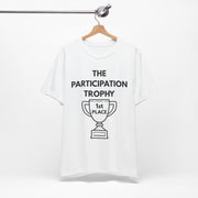 White t-shirt with 'The Participation Trophy 1st Place' text and graphic on a white background