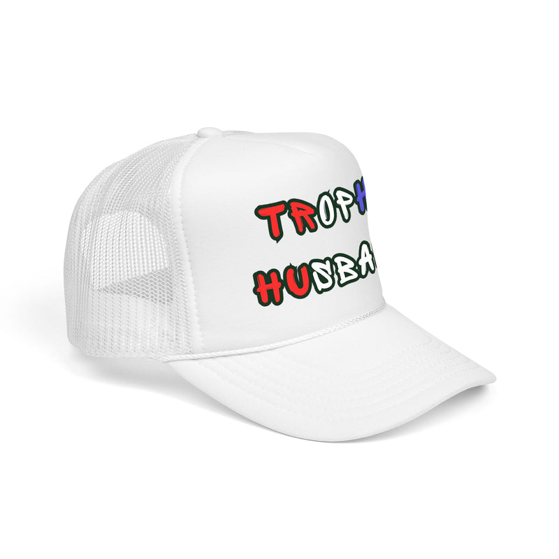 sideways view of a White trucker cap with 'Trophy Husband' in red white and blue text, against a white background