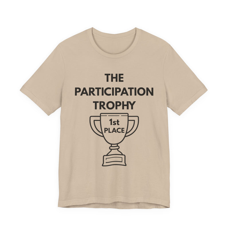 Beige t-shirt with 'The Participation Trophy 1st Place' text and graphic on a white background