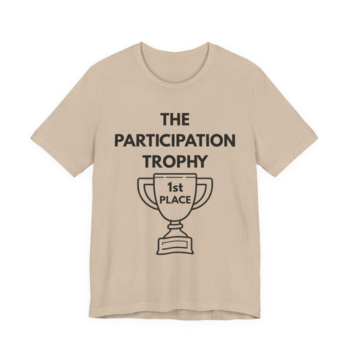 Beige t-shirt with 'The Participation Trophy 1st Place' text and graphic on a white background