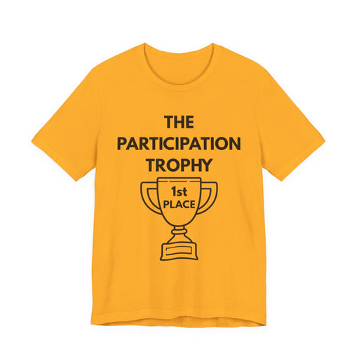 Gold t-shirt with 'The Participation Trophy 1st Place' text and graphic on a white background