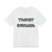 Ash t-shirt with 'Trophy Husband' text on a white background