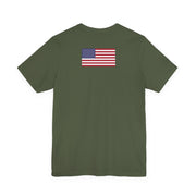 Back of a green t-shirt with American flag on the back against a white background