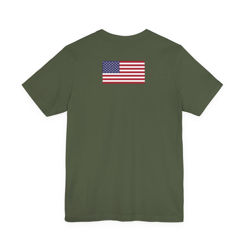 Back of a green t-shirt with American flag on the back against a white background