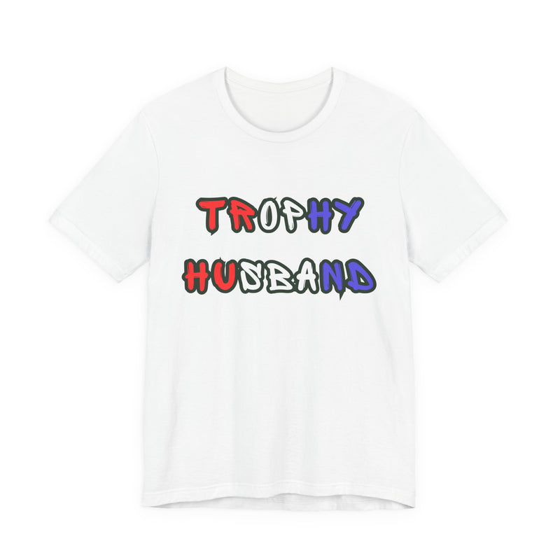 White t-shirt with 'Trophy Husband' in red white and blue text on a white background