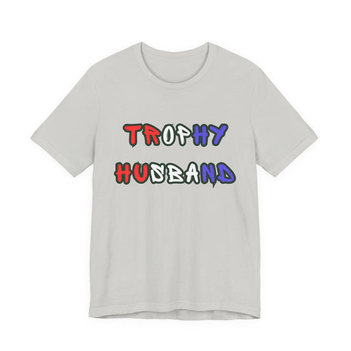 Gray t-shirt with 'Trophy Husband' in red white and blue text on a white background