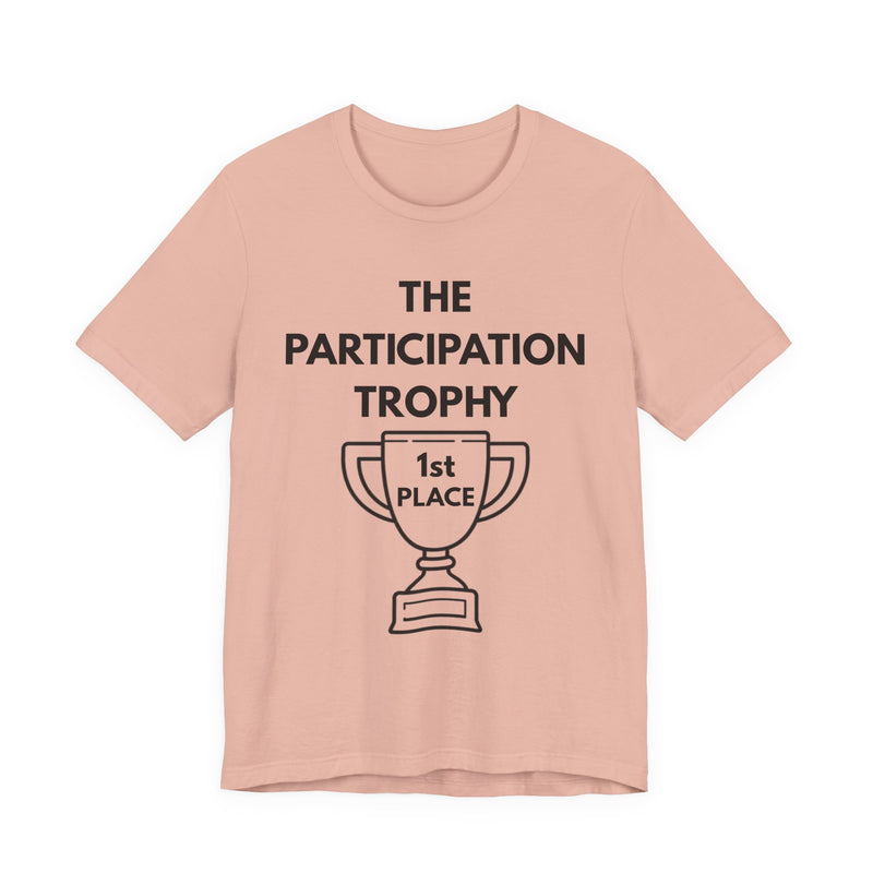 Pink t-shirt with 'The Participation Trophy 1st Place' text and graphic on a white background