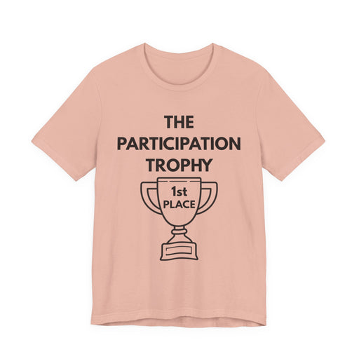 Pink t-shirt with 'The Participation Trophy 1st Place' text and graphic on a white background