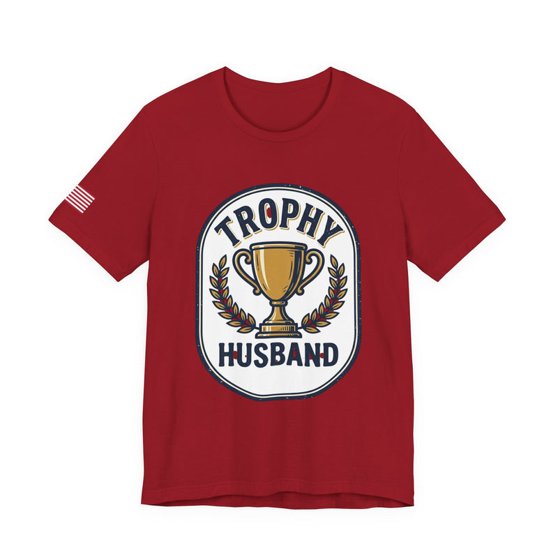 Red t-shirt with 'Trophy Husband' graphic on a white background
