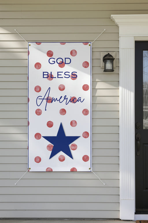 Patriotic “God Bless America” matte banner with red polka dot background, 72x36 and 48x24 inches on front of house.  